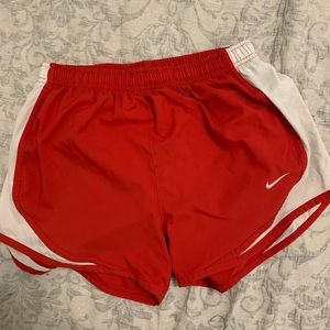 Red Nike running shorts